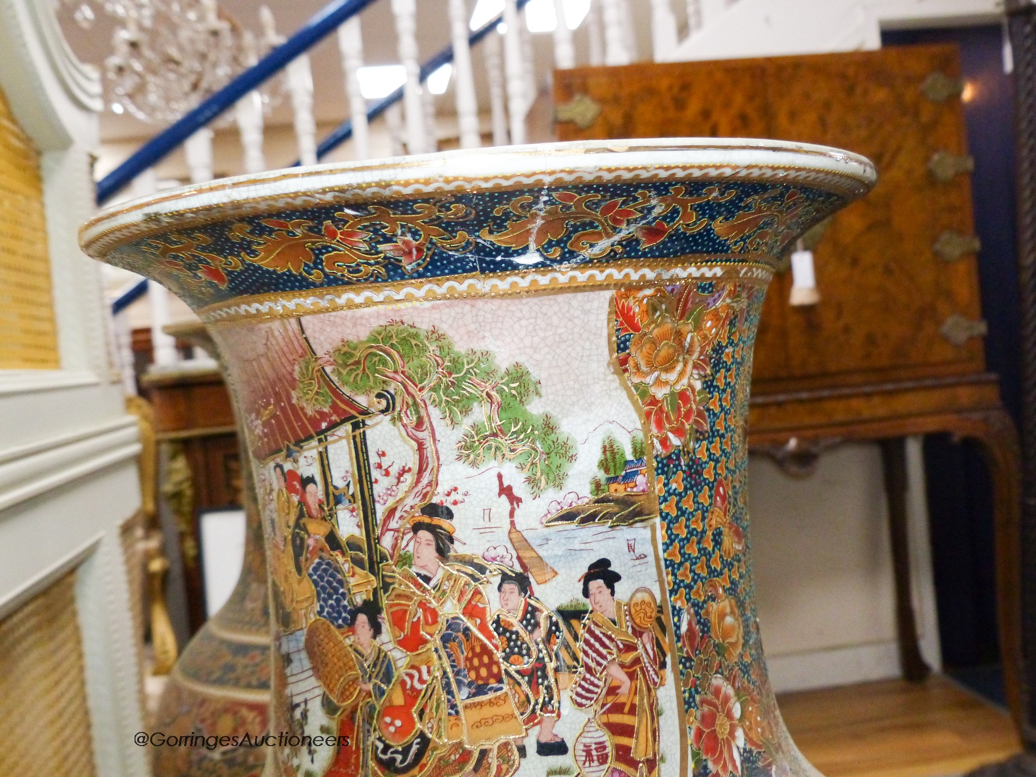 A pair of large Japanese vases, on hardwood stands